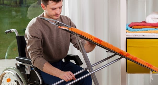 young man on wheelchair setting ...