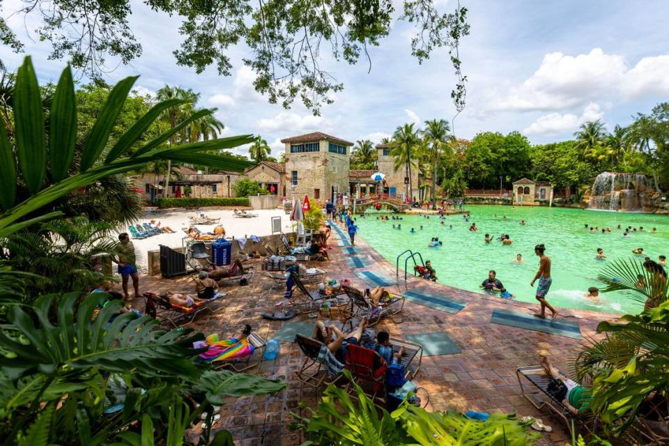 People socialize and swim at Venetian Pool on Wednesday, June 28, 2023, in Coral Gables, Florida.