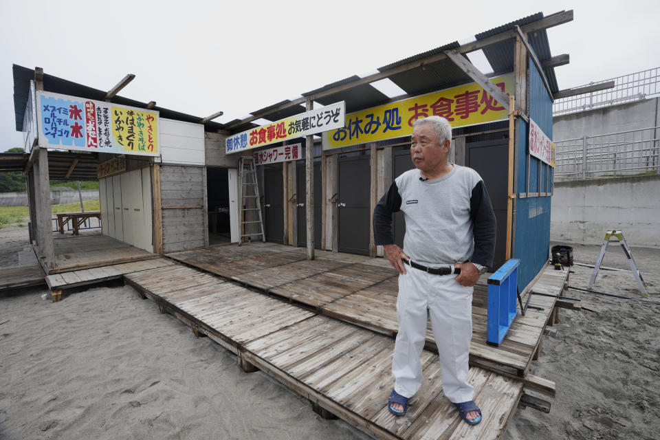 Yukinaga Suzuki, an inn keeper, speaks during an interview with The Associated Press at his beach house he also runs at the Usuiso beach in Iwaki, northeastern Japan, Thursday, July 6, 2023. He said, "I serve fresh local fish to my guests, and the beach house is for visitors to rest and chill out. The ocean is the source of my livelihoods, and without a healthy ocean I cannot make a living." (AP Photo/Hiro Komae)