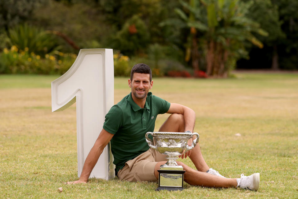 Novak Djokovic (pictured) poses with the Norman Brookes Challenge Cup.