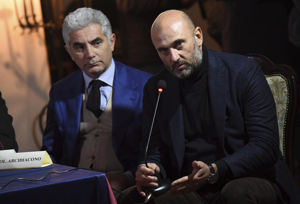 Italian Carabinieri Col. Lucio Arcidiacono, right, flanked by Col. Gianluca Valerio, speaks to reporters during a press conference in Palermo, Sicily, Monday, Jan. 16, 2023. Top Mafia boss Matteo Messina Denaro was arrested Monday at a private clinic in Palermo, Sicily, after 30 years on the run. (AP Photo/Salvatore Cavalli)