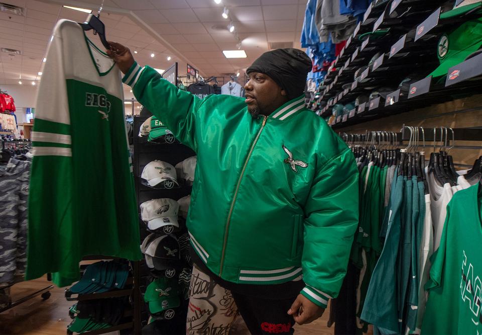 Amin Walker, of Bethlehem, looks over Philadelphia Eagles clothing at the Rally House in Fairless Hills, on Monday, Jan. 30, 2023.