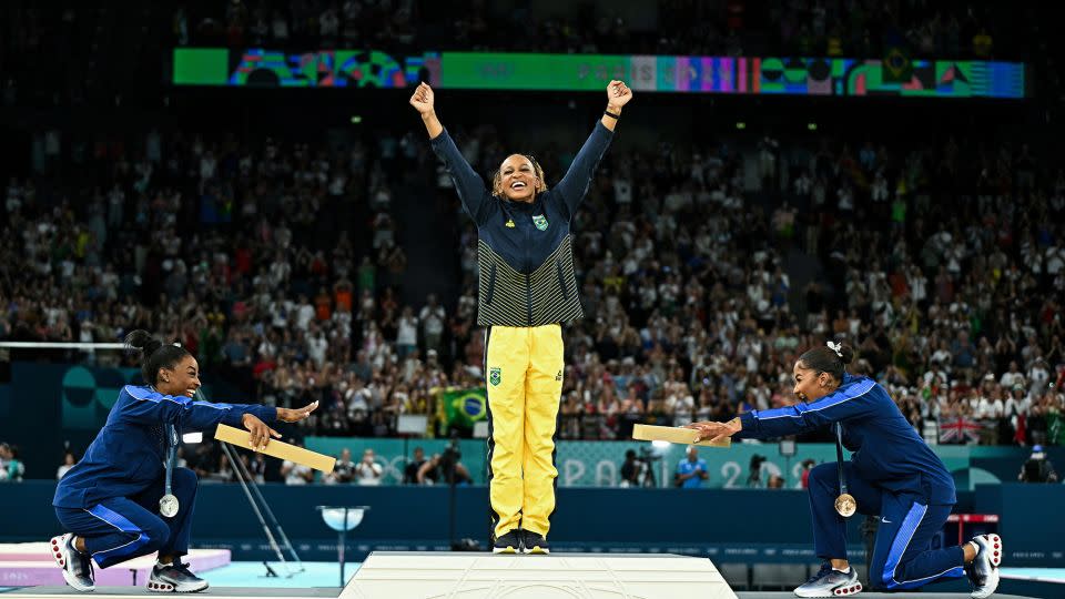 Left to right, US' Simone Biles (silver), Brazil's Rebeca Andrade (gold) and US' Jordan Chiles (bronze) pose during the podium ceremony. - Gabriel Bouys/AFP/Getty Images