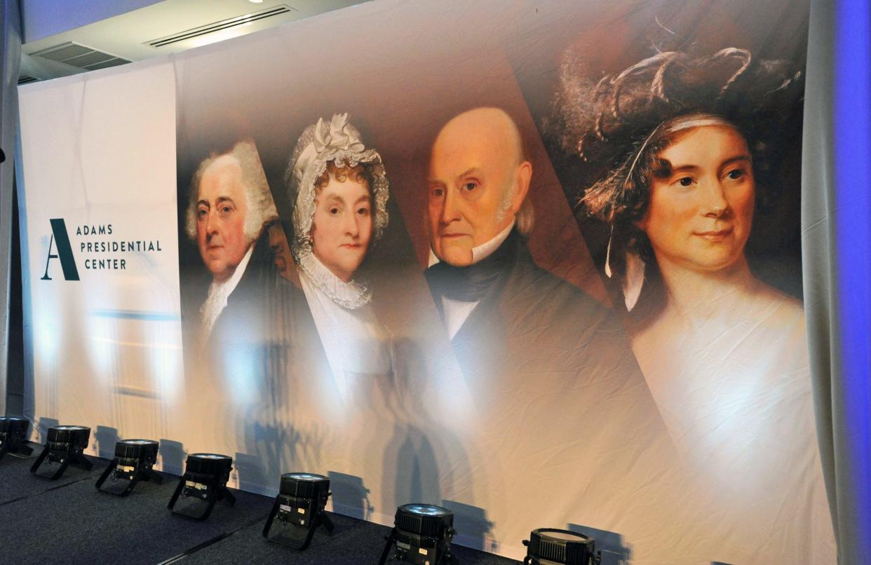 From left, portraits of President John Adams, first lady Abigail Adams, President John Quincy Adams and first lady Louisa Catherine Adams are displayed during the Adams Presidential Center fundraiser gala at Granite Links in Quincy in April.