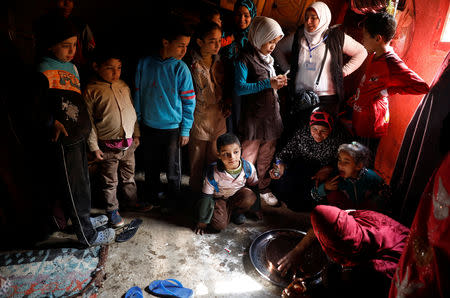 An Egyptian family prepare traditional sweets at their house in the province of Fayoum, southwest of Cairo, Egypt February 19, 2019. Picture taken February 19, 2019. REUTERS/Hayam Adel