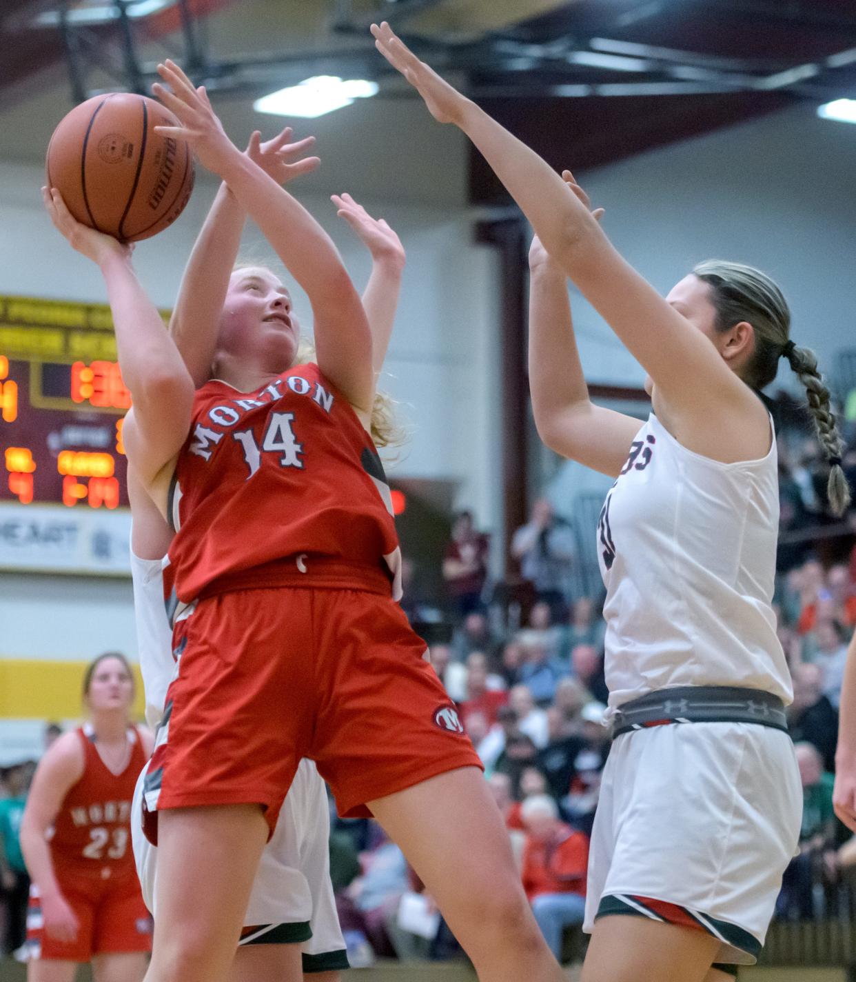 Morton's Addy Engel (14) tries to get a shot past the Lincoln defense in the second half of their Class 3A girls basketball sectional championship Thursday, Feb. 22, 2024 at East Peoria High School. The Railsplitters advanced to the super-sectional with a 61-30 win.