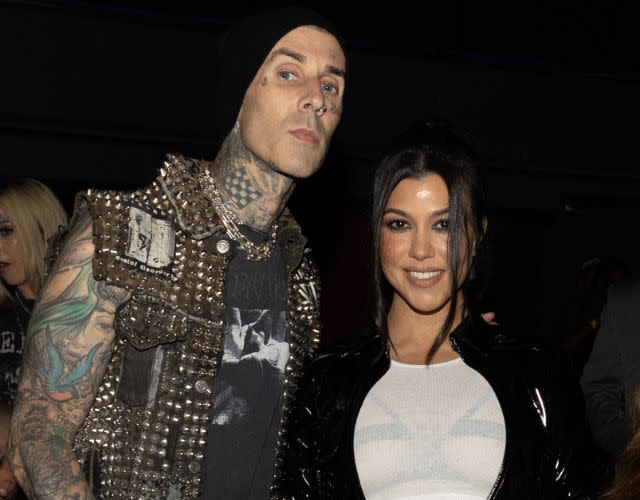 Travis Barker and Kourtney Kardashian backstage during Machine Gun Kelly: “Mainstream Sellout Tour” at the Kia Forum on July 13, 2022 in Inglewood, California. (Photo by Chris Polk/Penske Media via Getty Images)