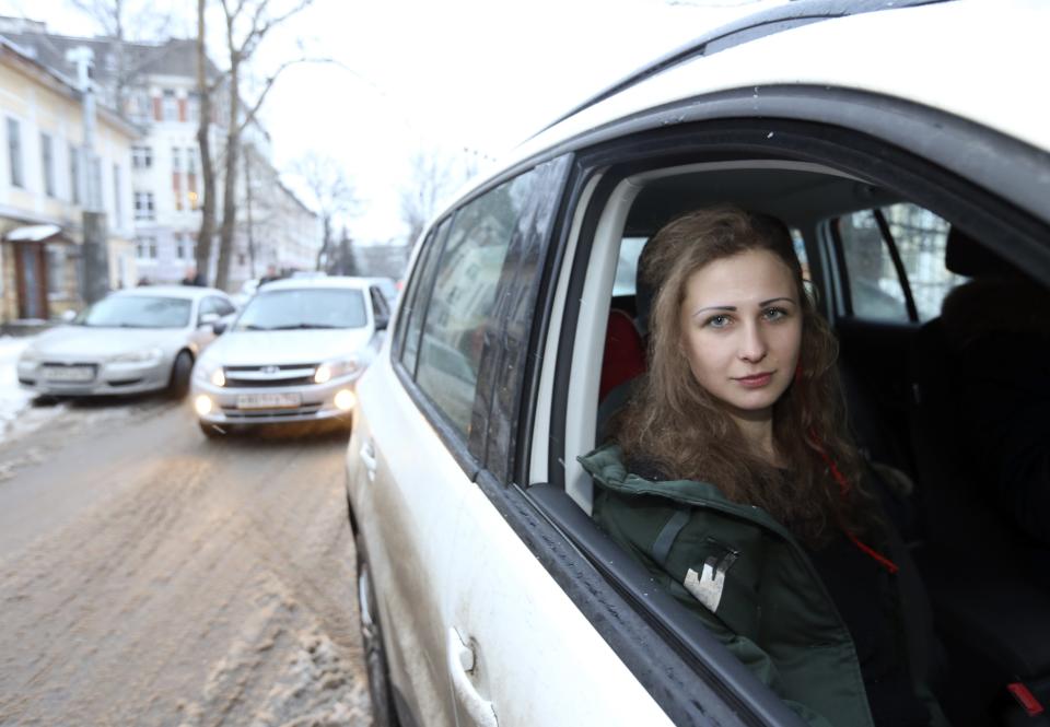 Alyokhina, member of Russian punk band Pussy Riot, sits in a car after her release from a penal colony in Nizhny Novgorod