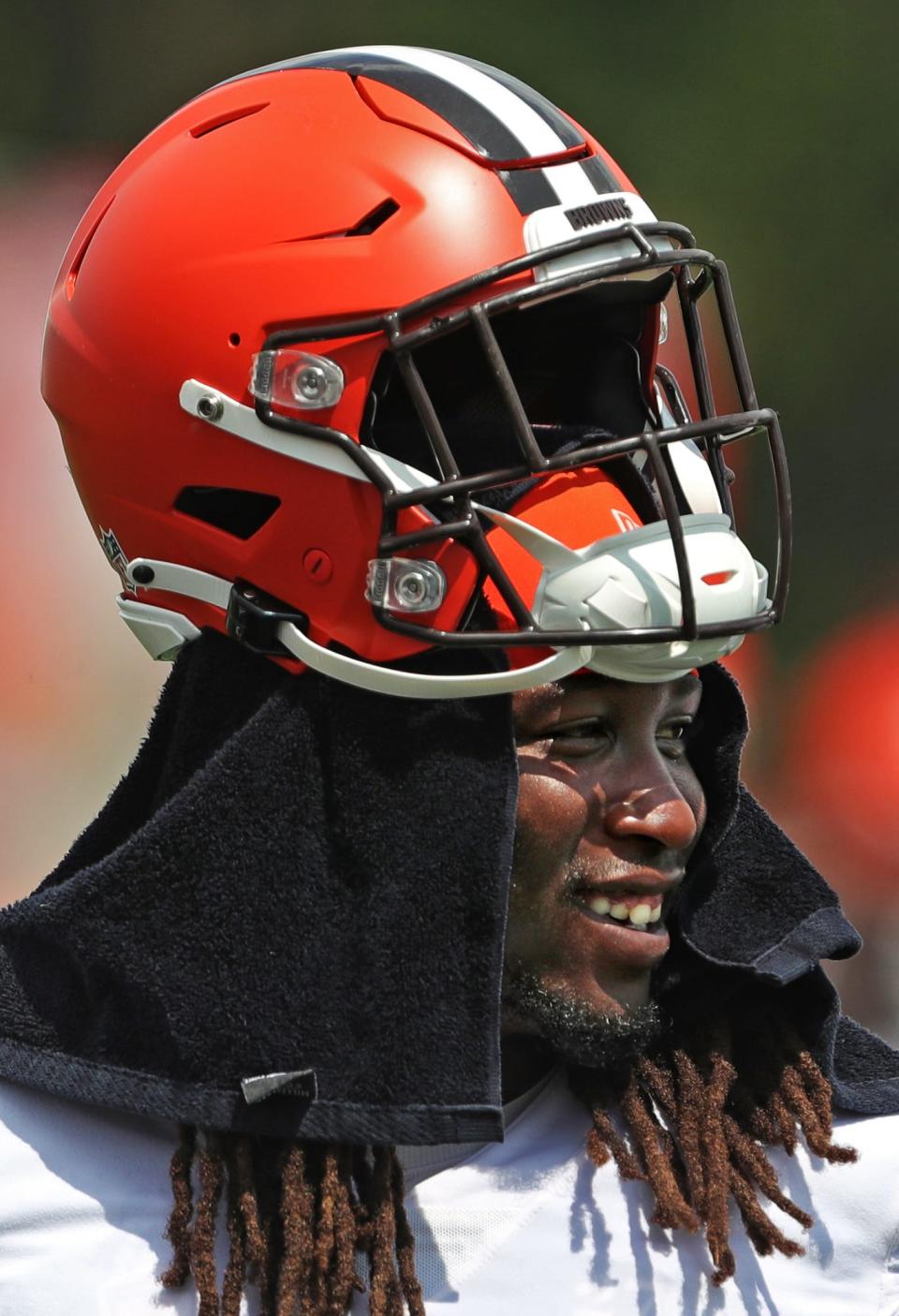 Cleveland Browns running back Kareem Hunt (27) does his best to stay cool on the sideline during NFL football practice, Thursday, Aug. 12, 2021, in Berea, Ohio.