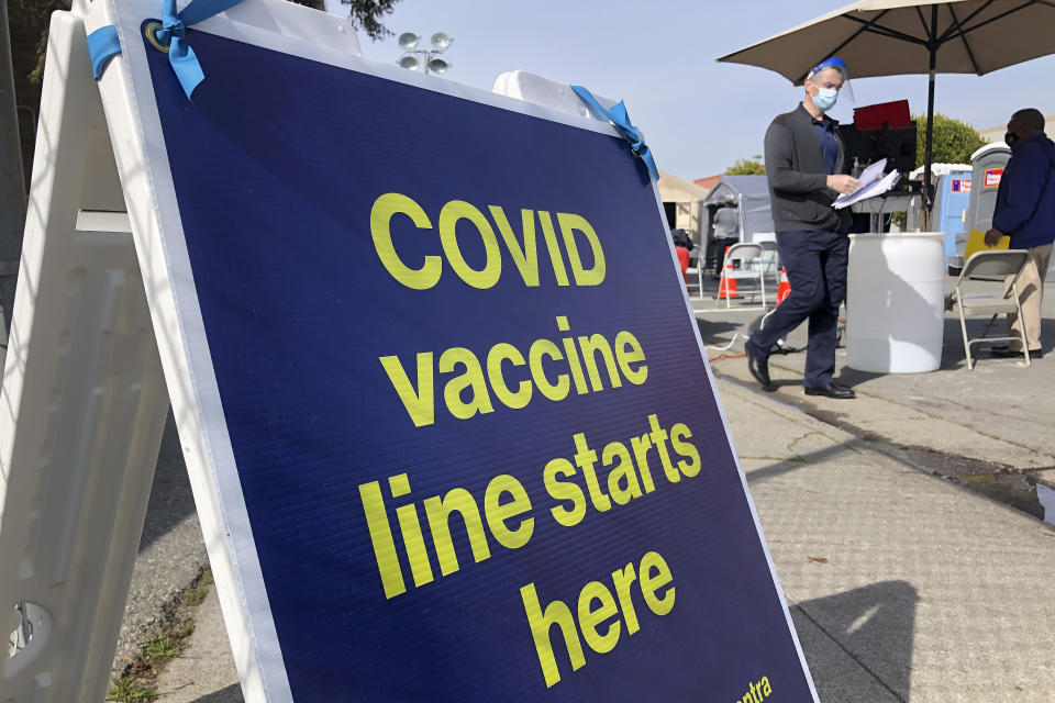 FILE - In this Feb. 8, 2021 file photo a sign is displayed at a COVID-19 vaccine site in the Bayview neighborhood of San Francisco. San Francisco city workers will be required to be vaccinated against the coronavirus when a vaccine receives full federal approval. The policy covering 35,000 municipal workers may be the first by any city or county in the U.S., the San Francisco Chronicle reported Wednesday, June 23. (AP Photo/Haven Daley,File)