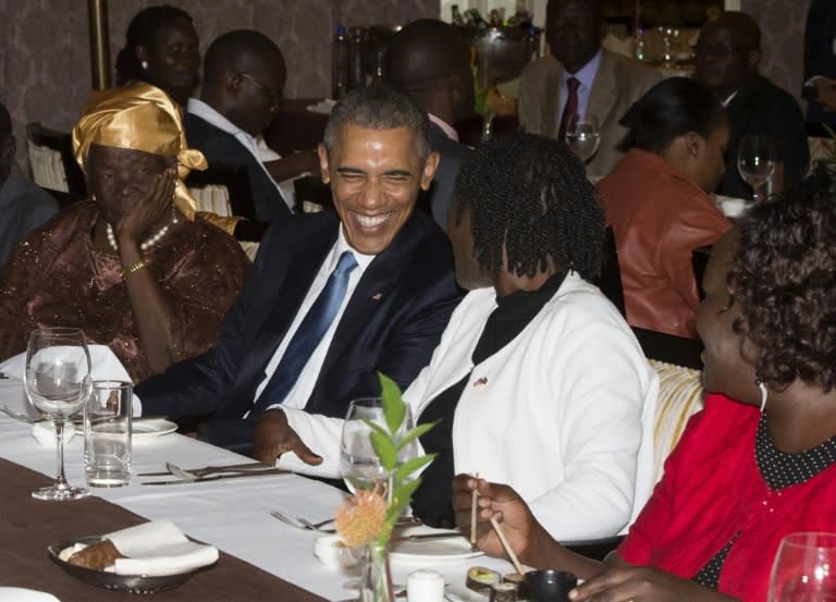 US President Barack Obama sits alongside his step-grandmother, Mama Sarah (L) and half-sister Auma Obama (R), during a gathering of family at his hotel in Nairobi, Kenya, July 24, 2015