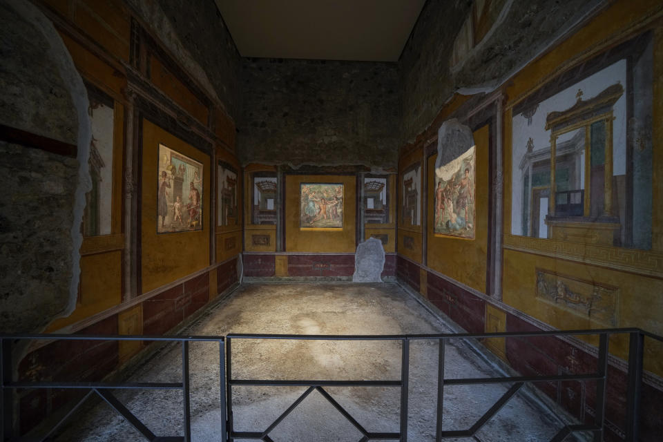 A view of a "triclinium", or dining room, called Hall of Pentheus, part of the Ancient Roman Domus Vettiorum, House of Vettii, in the in Pompeii archeological park, near Naples, southern Italy, Wednesday, Dec. 14, 2022. One of Pompeii's most famous and richest domus, which contains exceptional works of art and tells the story of the social ascent of two former slaves, is opening its doors to visitors Wednesday, Jan. 11, 2023 after 20 years of restoration. (AP Photo/Andrew Medichini)