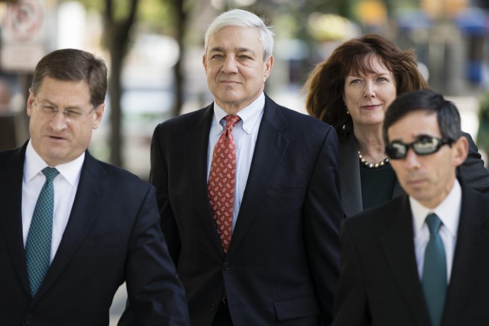 Former Penn State president Graham Spanier (center) arrives for his sentencing hearing. (AP)