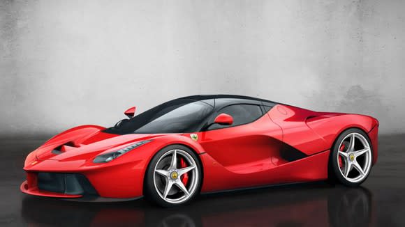 A red LaFerrari hypercar, a two-seat, mid-engine sports car.