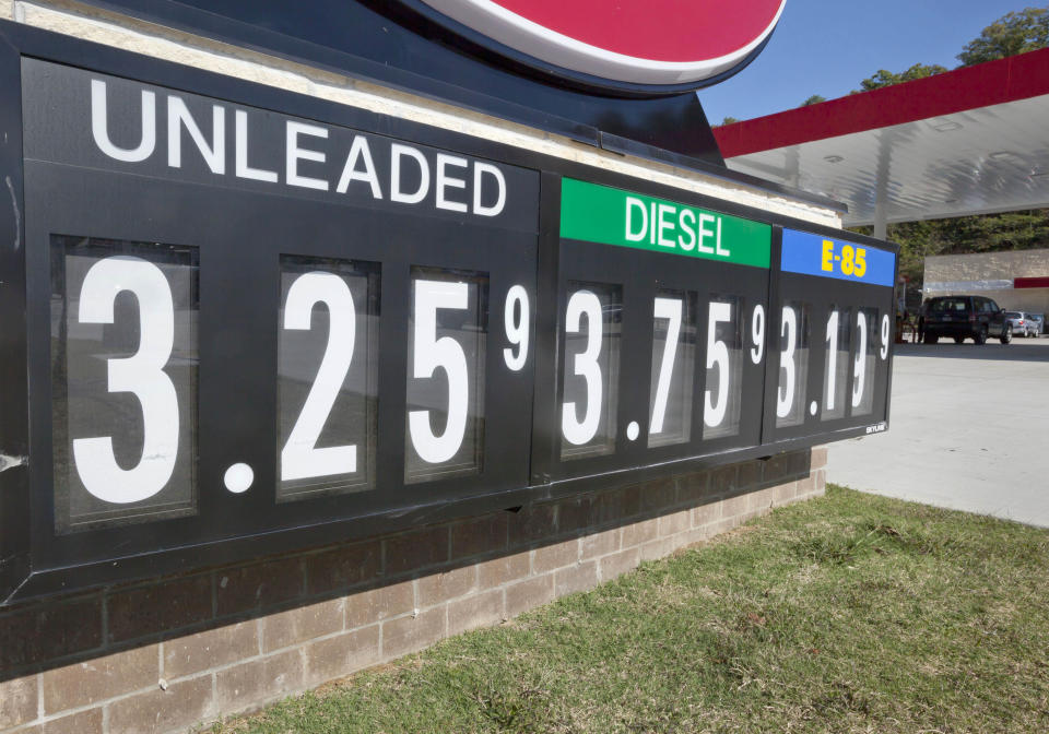 In this Tuesday, Oct. 30, 2012, photo, lower fuel prices are advertised at North Little Rock, Ark., gas station. Wholesale prices fell in October as a big drop in gasoline and other energy prices offset a rise in the cost of food. Wholesale prices dipped 0.2 percent last month, the Labor Department said Wednesday. It was the first decline since May and followed big gains of 1.1 percent in September and 1.7 percent in August, increases that had been driven by spikes in energy. (AP Photo/Danny Johnston)