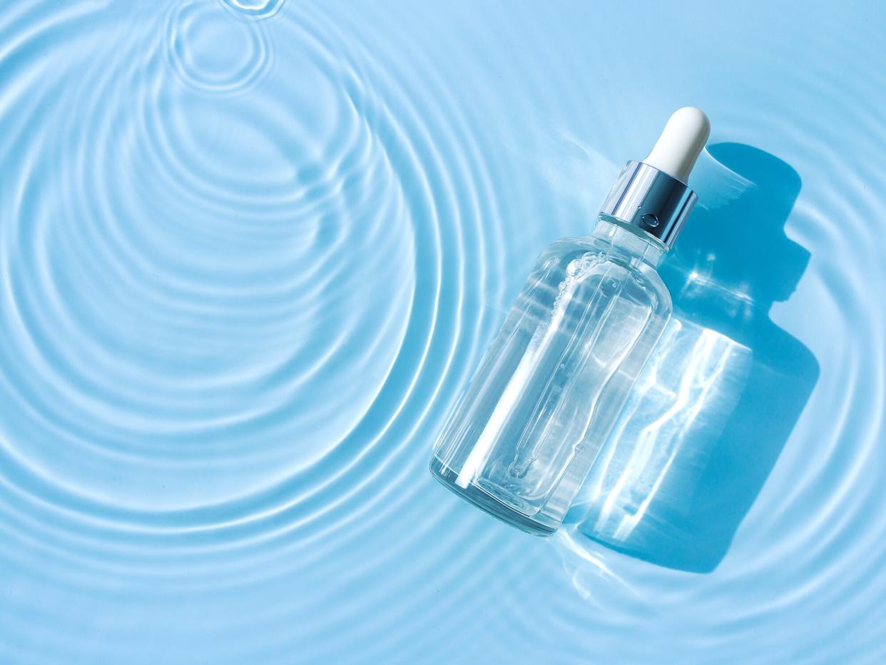 Clear bottle in rippling water