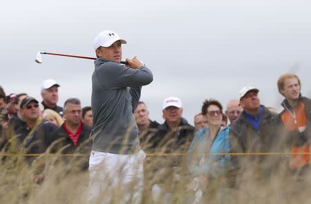 Jordan Spieth of the U.S. watches his tee shot on the tenth hole during the first round of the British Open golf championship on the Old Course in St. Andrews, Scotland, July 16, 2015. REUTERS/Eddie Keogh