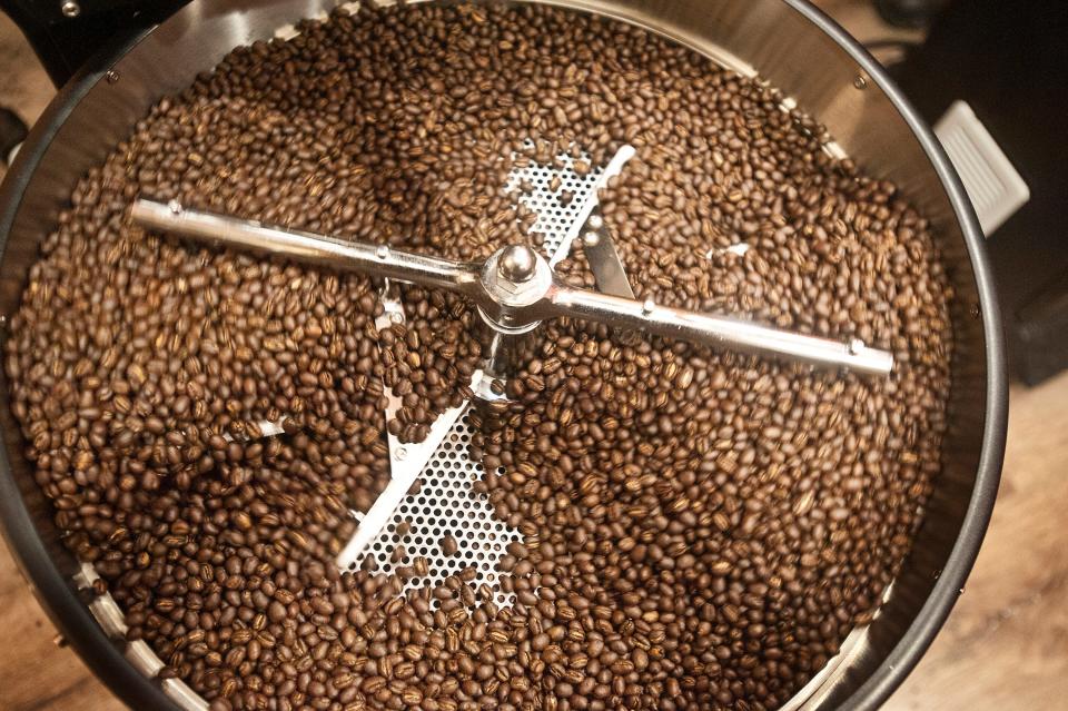 Coffee beans roast in the Ntaba Coffee Haus new coffee roaster move about the pan pushed by a rotator arm. June 2019