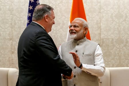 U.S Secretary of State Pompeo shakes hands with Indian Prime Minister Narendra Modi in New Delhi
