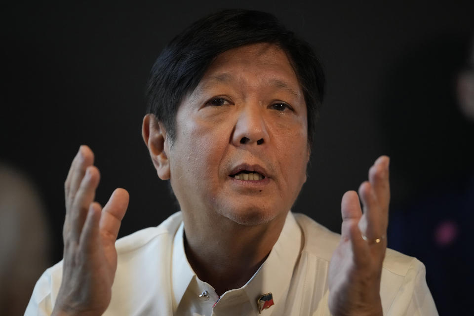 Philippine President-elect Ferdinand "Bongbong" Marcos Jr. gestures during a press conference at his headquarters in Mandaluyong, Philippines on Monday, June 20, 2022. Marcos expressed fears Monday of a potential food crisis largely due to the war in Ukraine and said he would also serve as agriculture chief when he takes office to brace for possible emergencies. (AP Photo/Aaron Favila)