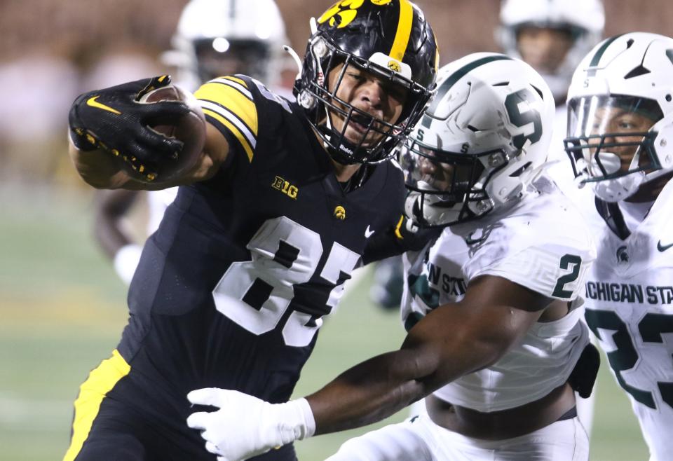 Iowa tight end Erick All scores a touchdown against Michigan State defensive lineman Khris Bogle, right, and linebacker Darius Snow during the first half of MSU's 26-16 loss Saturday, Sept. 30, 2023, in Iowa City, Iowa.