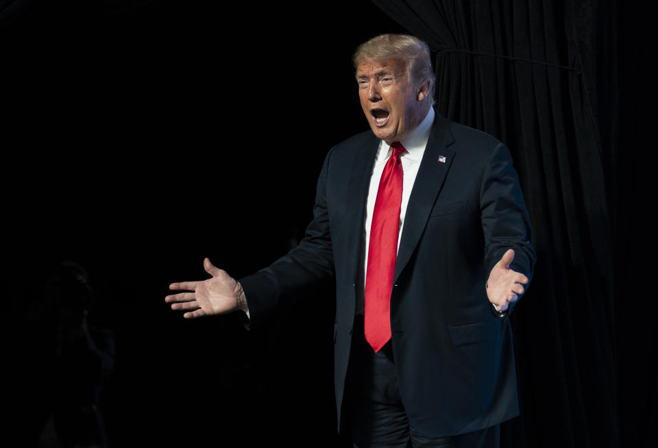 FILE - In this June 23, 2020, file photo, President Donald Trump arrives to speak to a group of young Republicans in Phoenix. The Republican president is hoping that a high-profile appearance at Mount Rushmore this Friday can help boost his standing. (AP Photo/Evan Vucci, File)