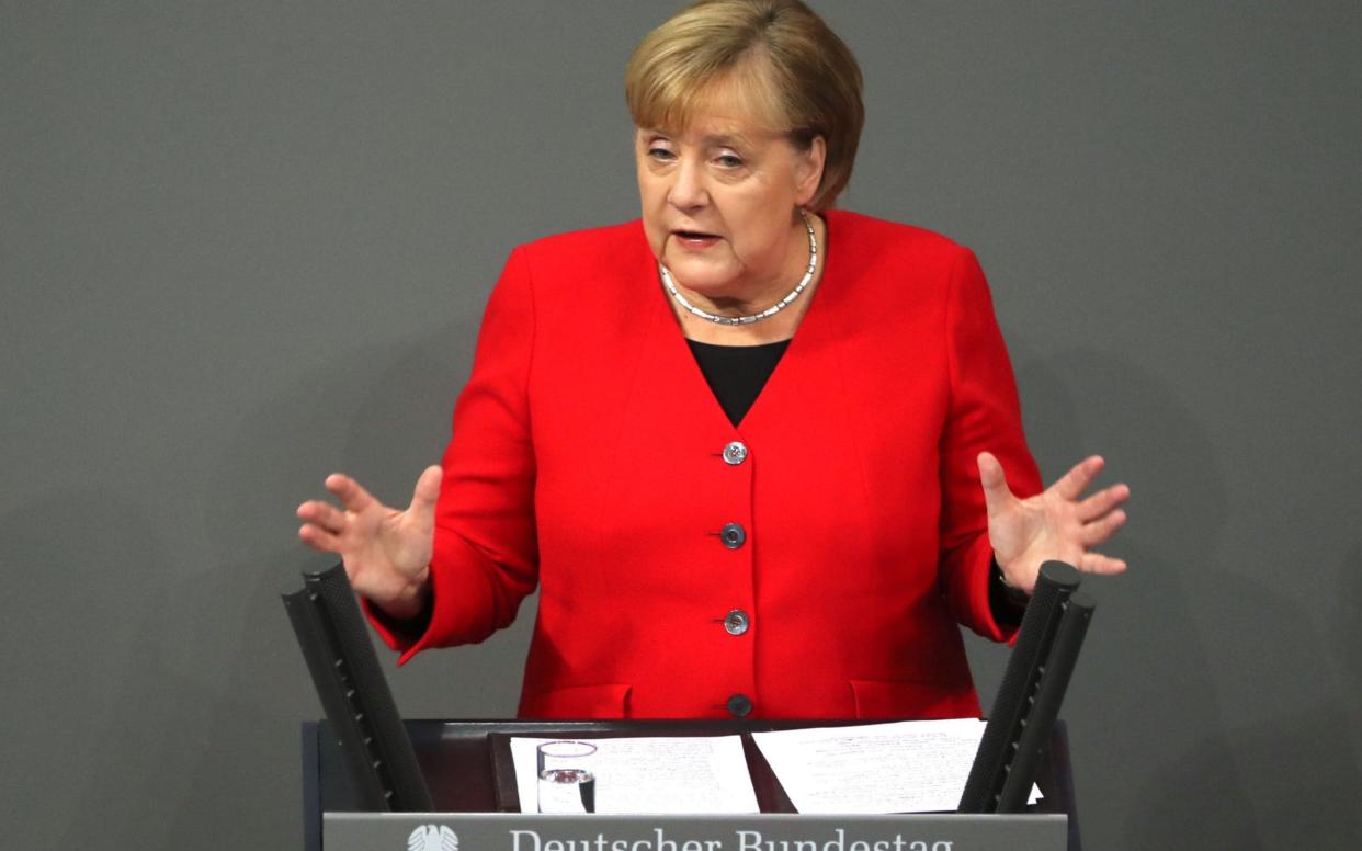 Angela Merkel was speaking in a budget debate in the German parliament - REX