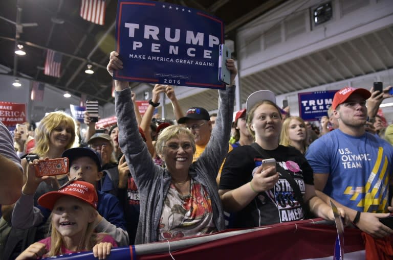 Supporters cheer as Republican presidential nominee Donald Trump speaks in Delaware, Ohio on October 20, 2016