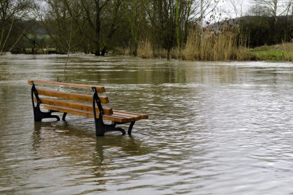 a bench surrounded by water
