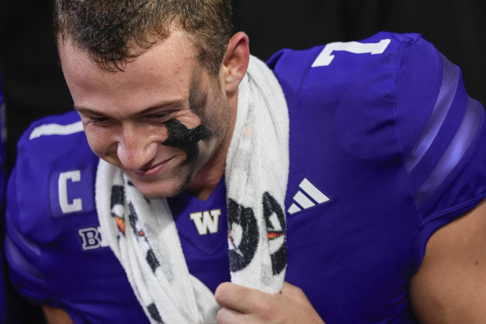 Washington quarterback Will Rogers smiles after a 27-17 win over Michigan in an NCAA college football game Saturday, Oct. 5, 2024, in Seattle. (AP Photo/Lindsey Wasson)