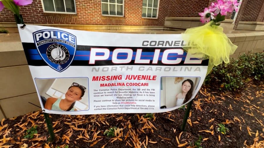 A sign in font of the Cornelius Police Dept. showing the search is still on for Madalina.