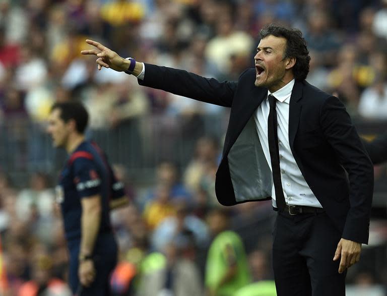 Barcelona's coach Luis Enrique shouts during the Spanish league football match FC Barcelona v Valencia CF at the Camp Nou stadium in Barcelona on April 18, 2015