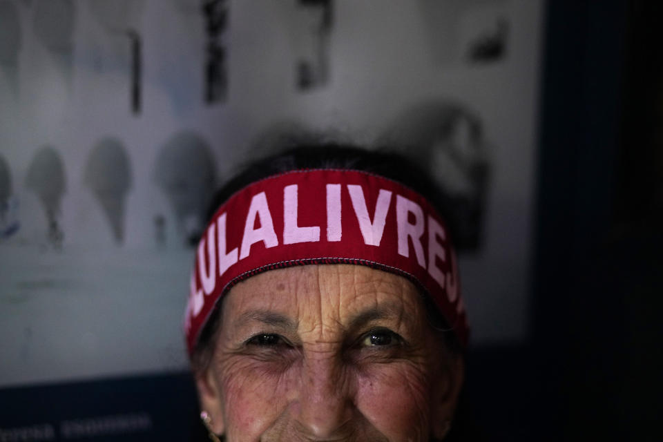 A supporter of Brazil's former President Luiz Inacio Lula da Silva wears a head band that reads "Free Lula" during a protest against cuts in Brazil's public education sector at Cinelandia square, Rio de Janeiro, Brazil, Friday, May 10, 2019. In recent weeks, Brazil's Education Ministry has unveiled a series of budget cuts impacting all sectors of education from early childhood to post-graduate students. Universities were hit by 30% cut of their discretionary expenses and future scholarships for masters and PhD students were suspended. (AP Photo/Ricardo Borges)