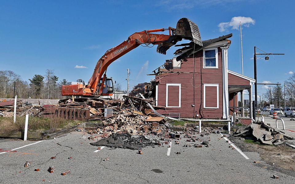 The old Assinippi General Store is demolished to make way for expansion of Merchants Row on Washington Street in Hanover on Wednesday April 24, 2024