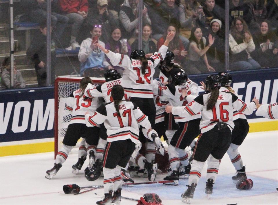 Members of the Ohio State women's hockey team celebrate after the final buzzer sounds in its 1-0 victory over Wisconsin in the NCAA championship game at Whittemore Center Arena on Sunday March 24, 2024 in Durham, New Hampshire.