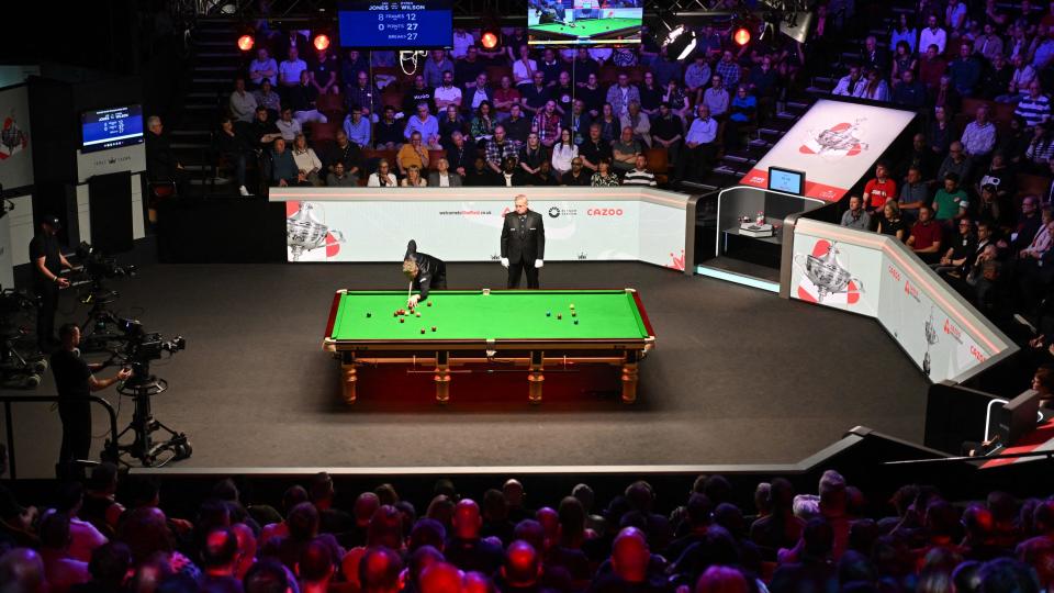 Kyren Wilson plays a shot during the 2024 World Championship Snooker final at The Crucible