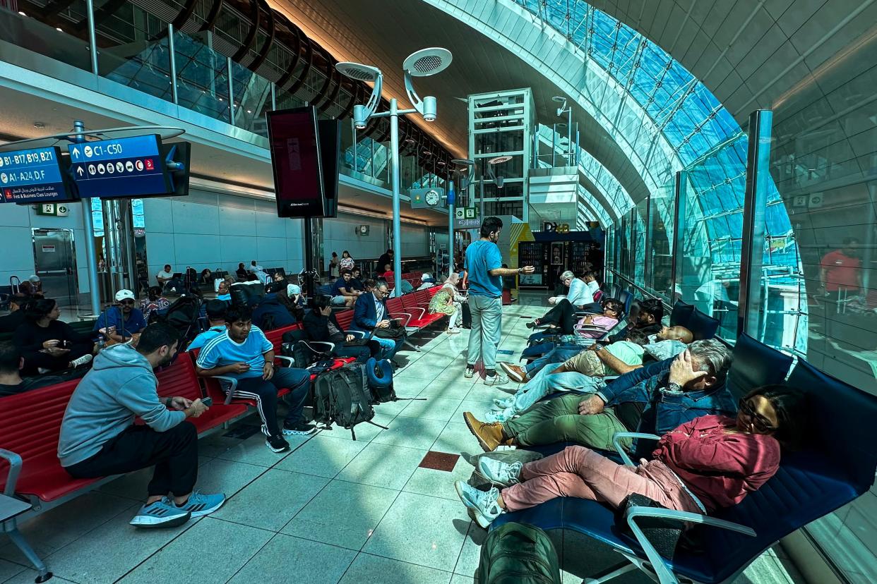 Passengers wait for their flights at the Dubai International Airport in Dubai on April 17, 2024.