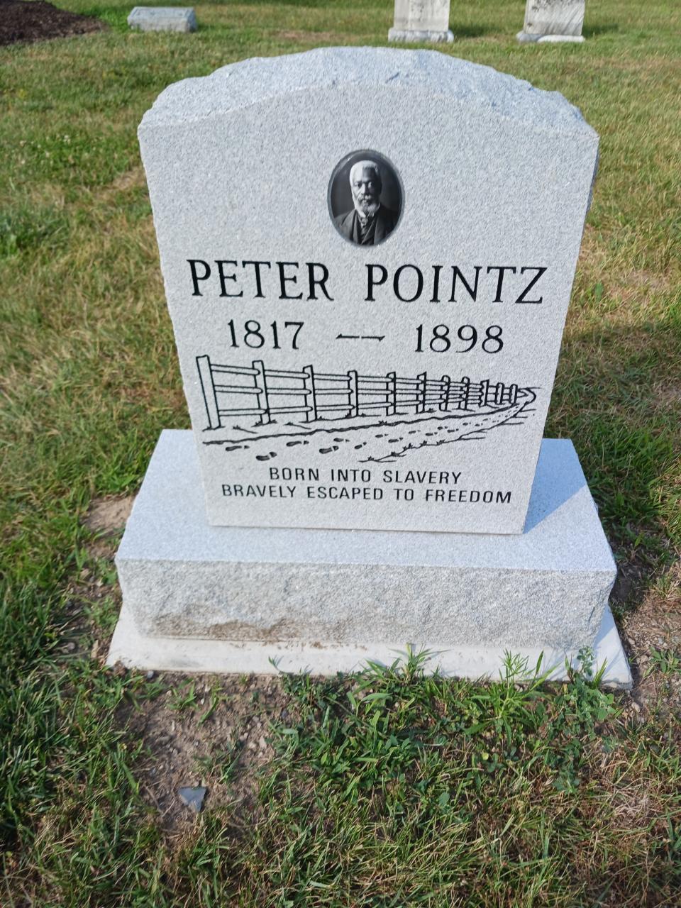 The newly installed headstone for Peter Pointz, who died more than 100 years ago.