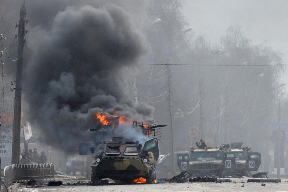 A Russian armoured personnel carrier burns during clashes with  Ukrainian armed forces in Kharkiv (AFP via Getty Images)