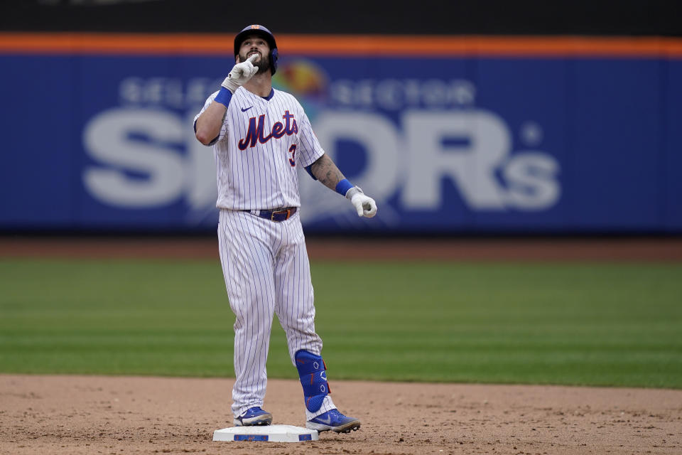 New York Mets' Tomas Nido reacts on second base after hitting a two-run double off Washington Nationals relief pitcher Jordan Weems in the eighth inning of a baseball game, Wednesday, June 1, 2022, in New York. (AP Photo/John Minchillo)