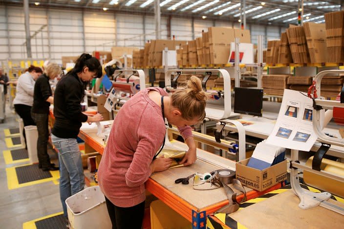 Workers at an Amazon distribution centre: Getty Images