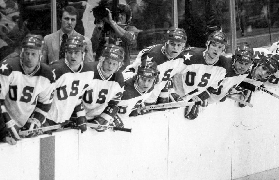 In this Feb. 22, 1980, photo, United States coach Herb Books and players look to the action on the ice during a medal-round game against the Soviet Union at the Winter Olympics in Lake Placid, N.Y. Tourism is a $1.2 billion industry in the Lake Placid region, much of it still fueled by the memory of the U.S. hockey team beating the Soviet Union as the “Miracle on Ice" highlight of the 1980 Olympic Games. (Tom Sweeney/Star Tribune via AP)