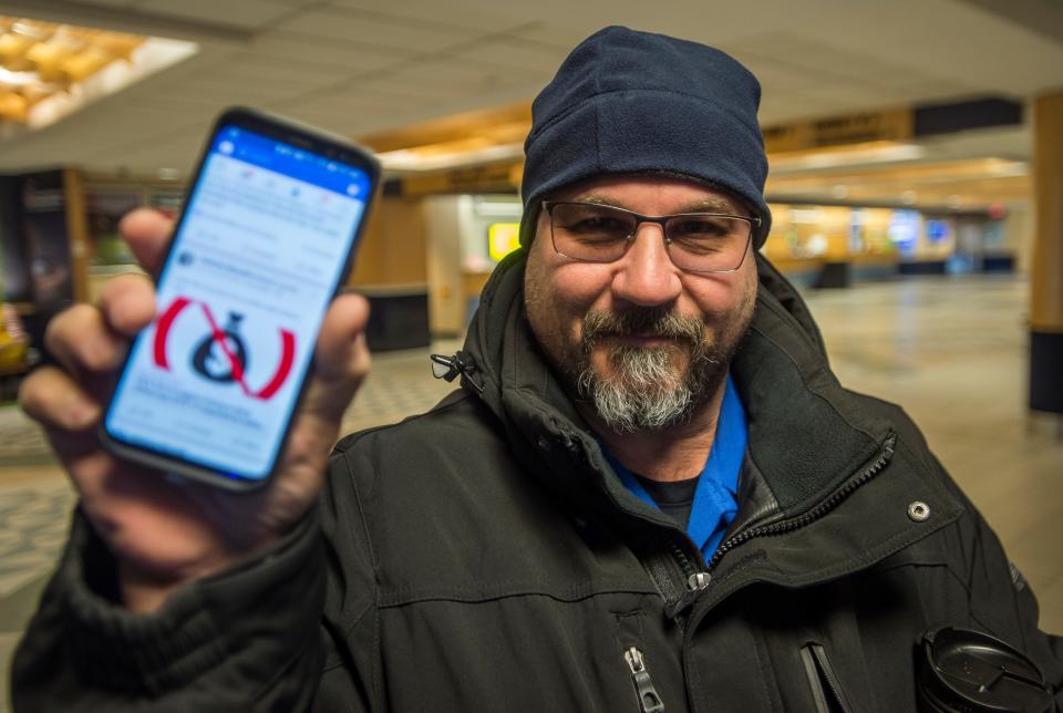 TSA agent Anthony Morselli of Georgia, VT, shows his GoFundMe post on Facebook before starting his shift at Burlington International Airport on Friday, Jan. 11, 2019. Morselli and his wife, both TSA agents, didn't get paid along with approximately 800,000 other federal workers and, to try to make ends meet, started the GoFundMe site to try to pay the bills as the government shutdown entered its 21st day.