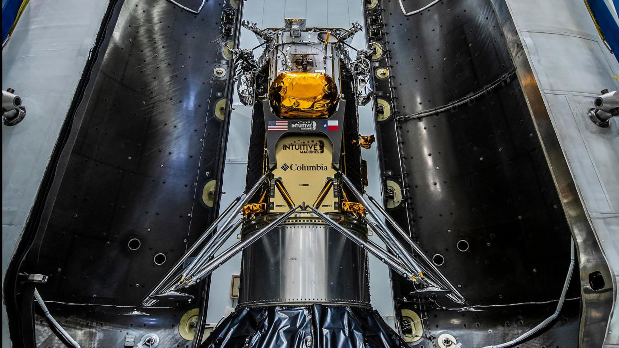  Intuitive Machines moon lander Im-1 sits between its SpaceX Falcon 9 rocket fairing ahead of launch. 