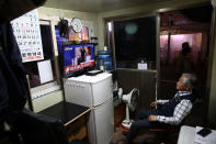 <p>A South Korean man watches reporting on President Trump arriving in Singapore on Sunday. (Photo: Chung Sung-Jun/Getty Images) </p>