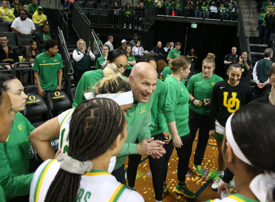 Oregon coach Kelly Graves, center, brings his team together before their game against Rice in the 2023 WNIT second round March 20 in Eugene.