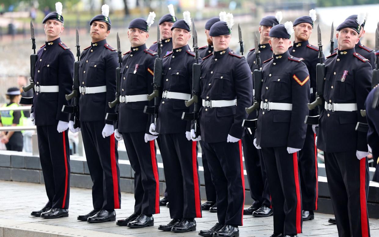 The Royal Welsh, who formed a Guard of Honour, welcome the King and Queen