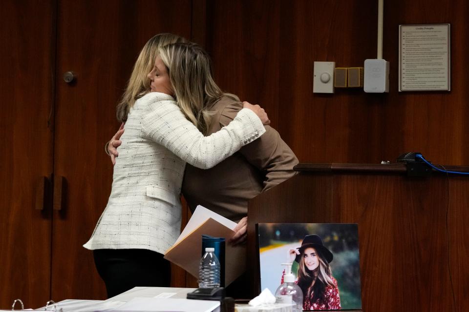 Oakland County prosecutor Karen McDonald hugs Nicole Beausoleil, mother of Madisyn Baldwin, after Nicole's victim impact statement, Friday, Dec. 8, 2023, in Pontiac, Mich. Parents of students killed at Michigan's Oxford High School described the anguish of losing their children Friday as a judge considered whether Ethan Crumbley, a teenager, will serve a life sentence for a mass shooting in 2021.