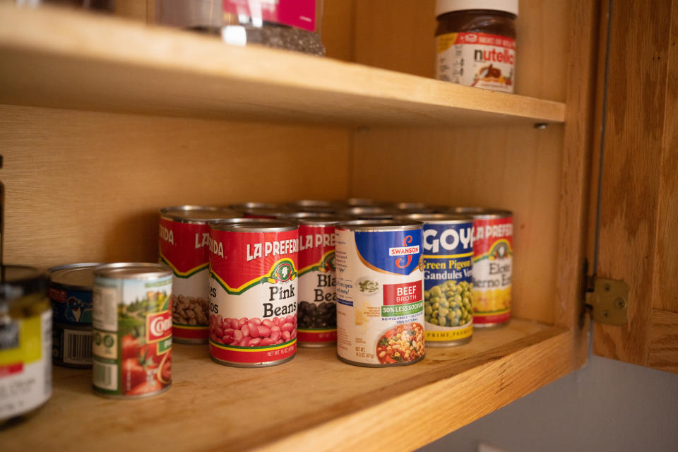 Canned food in a cabinet.
