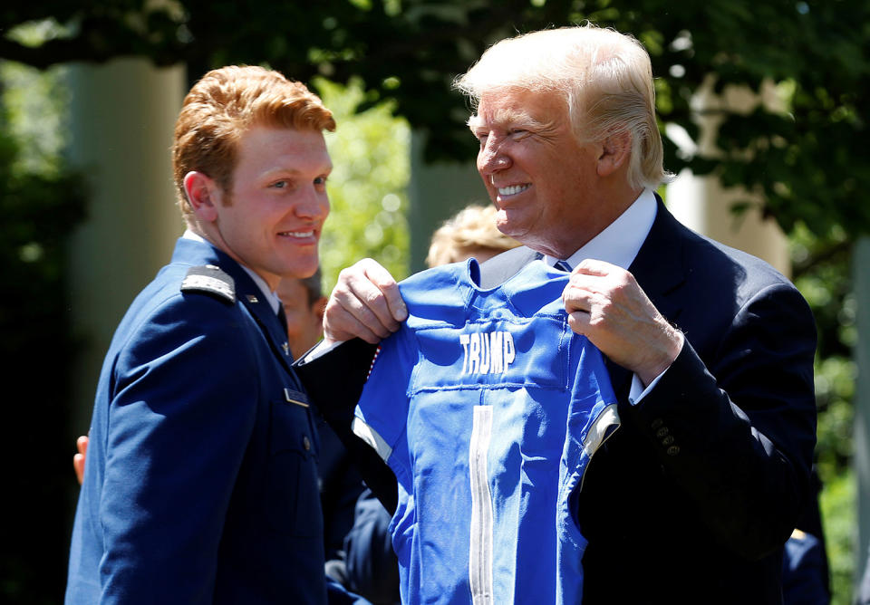 President Trump holds up a U.S. Air Force Academy football jersey